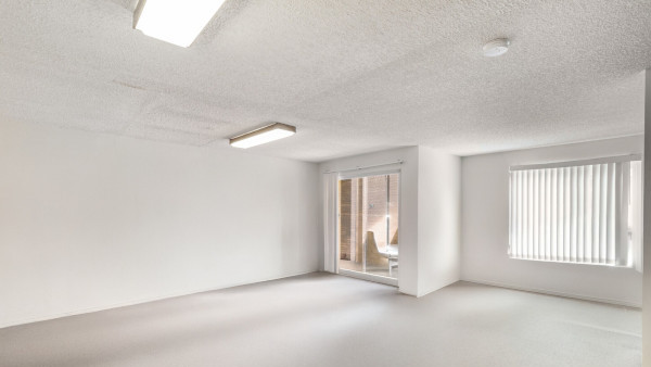 Villa Virigina apartment kitchen interior livingroom showing sliding glass door to balcony thumbnail